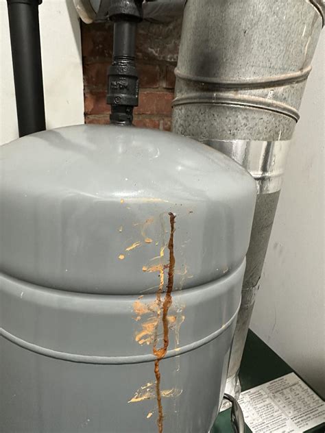 expansion tank leaking from bottom|Expansion Tanks: Signs of Failure, Safety Concerns & Costs to。